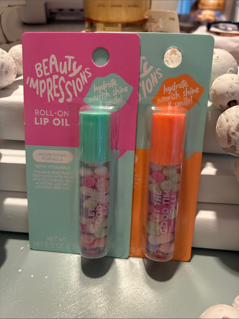 Impressions Roll-On Lip Oil Duo with Teal & Orange Caps